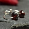 Sterling silver hoops with garnet