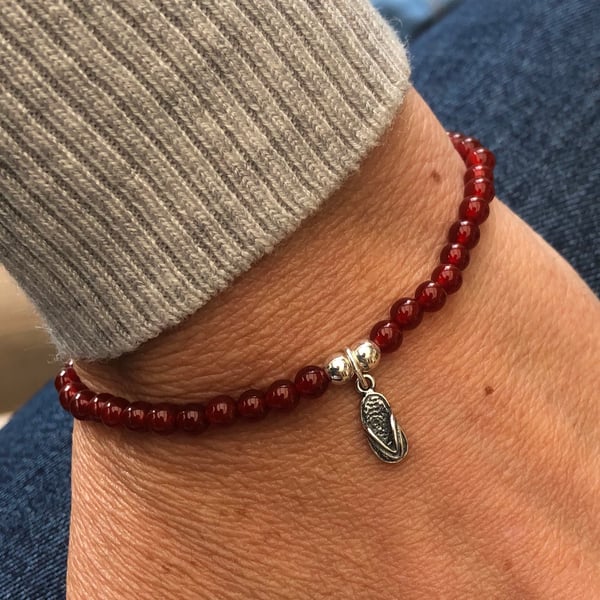 Red carnelian beaded bracelet with flip flop charm