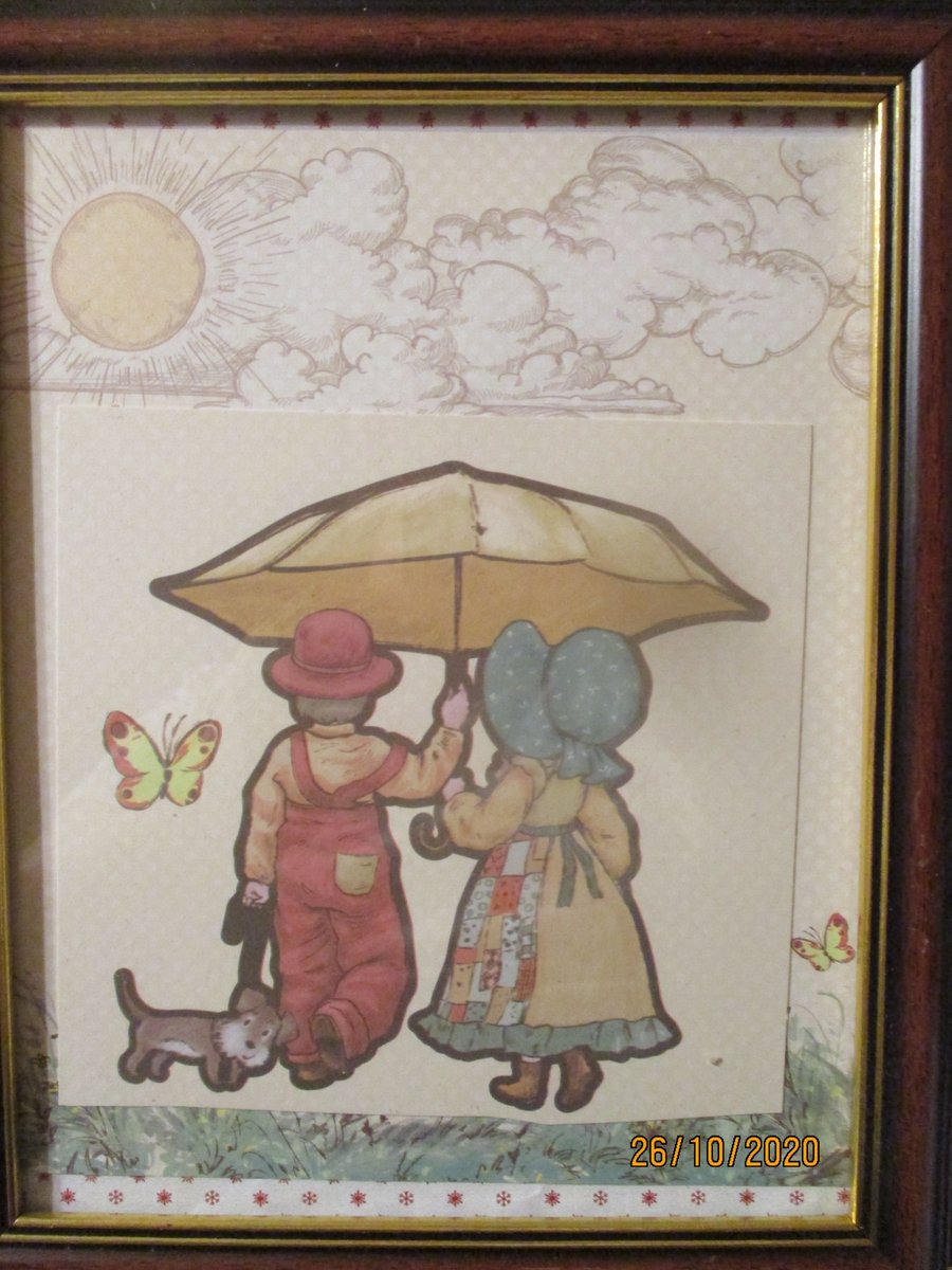 Girl and Boy Under an Umbrella Picture
