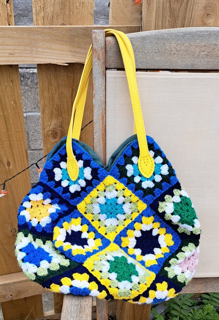 Colourful crochet bag with yellow handles 