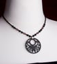 Black butterfly necklace with black and purple beads - Image 1