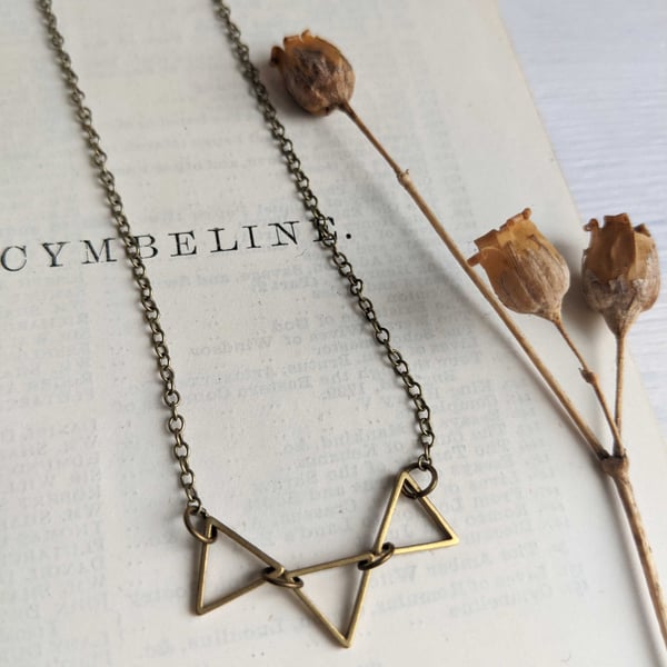 Golden Triangles charm necklace - petite triangles in a row - geometric