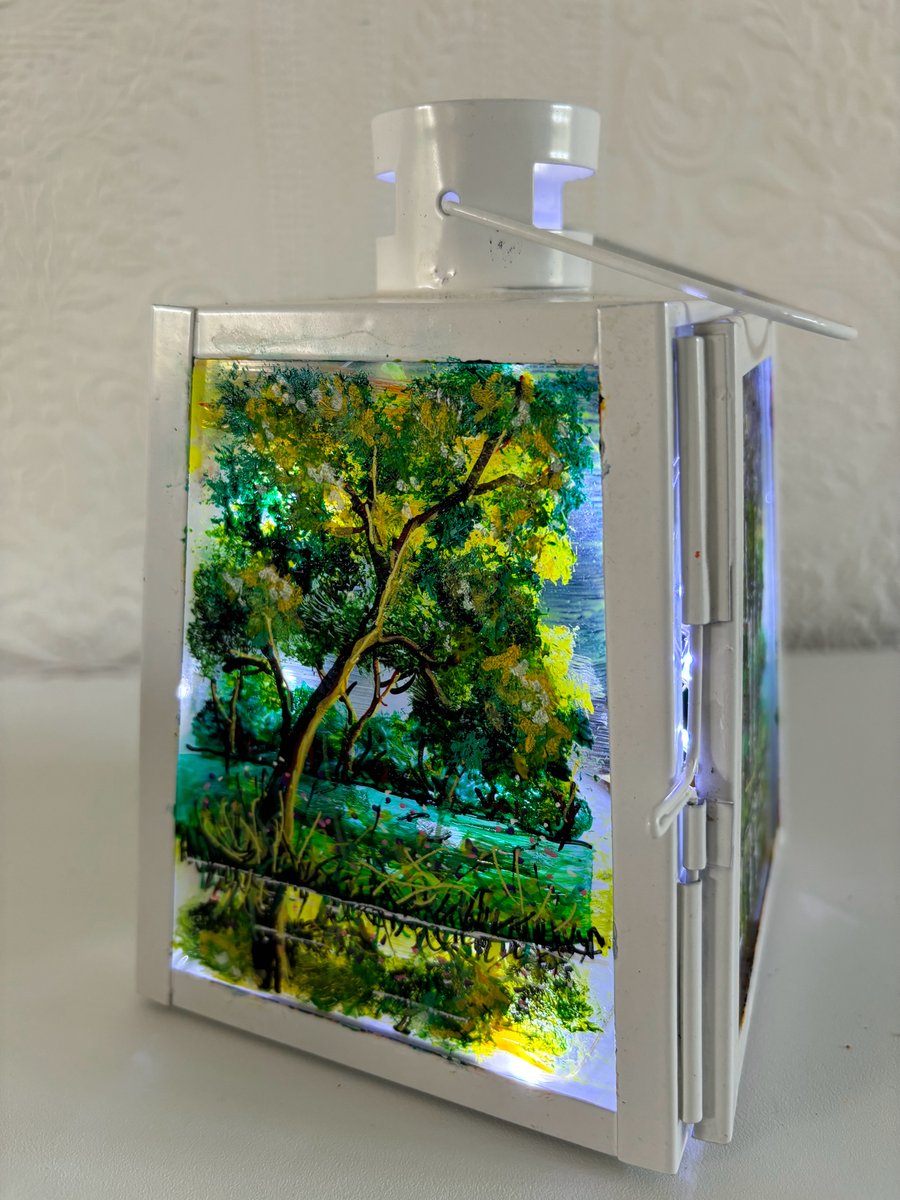 A hand painted and fired metal and glass lantern by Andrew Jenkins 