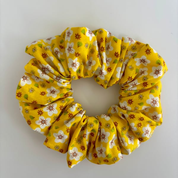 Cotton scrunchie hair accessory in a yellow and white fun print