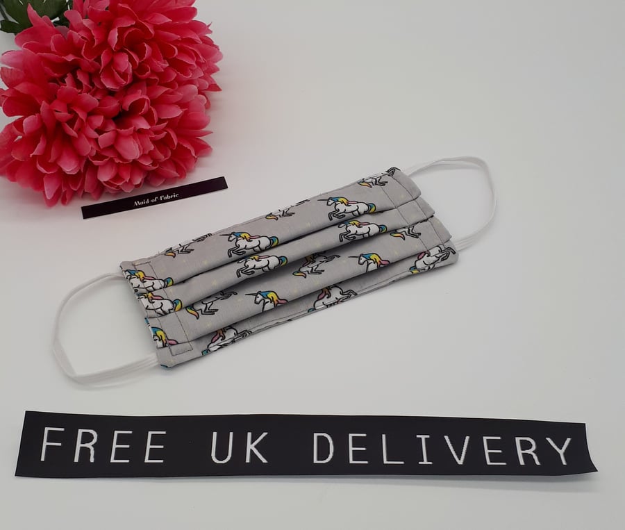 Face mask,  small, 3 layer,  machine washable in grey unicorn fabric.  