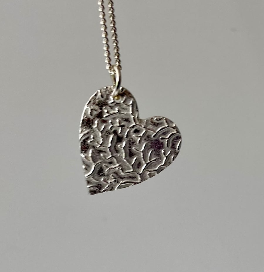 Silver heart necklace with lovely texture 