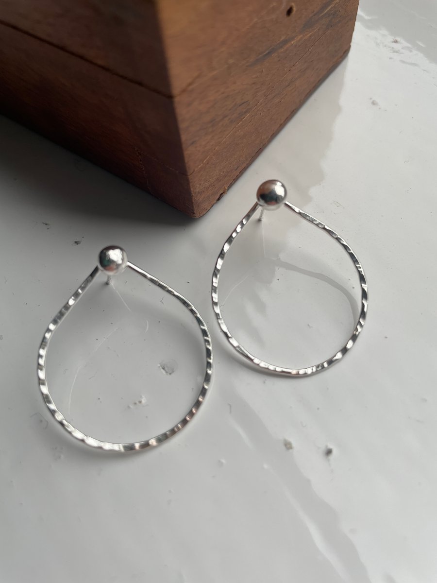 Delicate tear drop earrings with hammered texture and silver ball accent