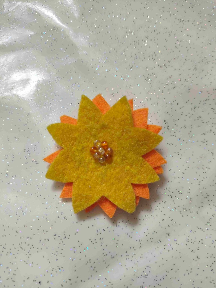 Handmade yellow sun brooch