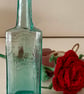 Single red rose in an antique bottle - Image 8