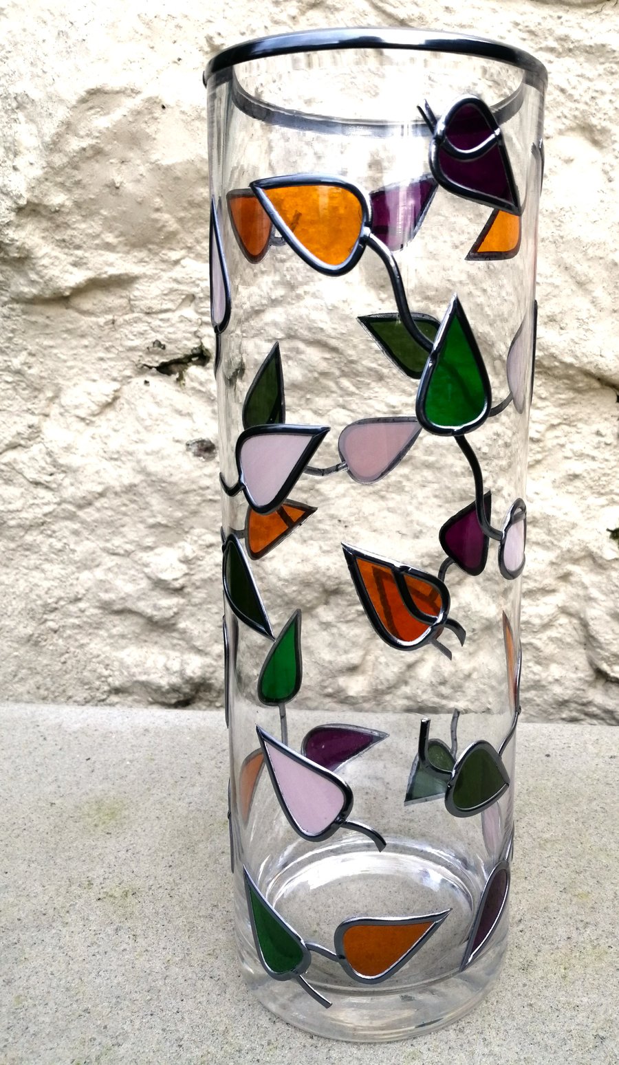 Dancing Leaves is a stained glass effect flower vase hand leaded 30cm tall