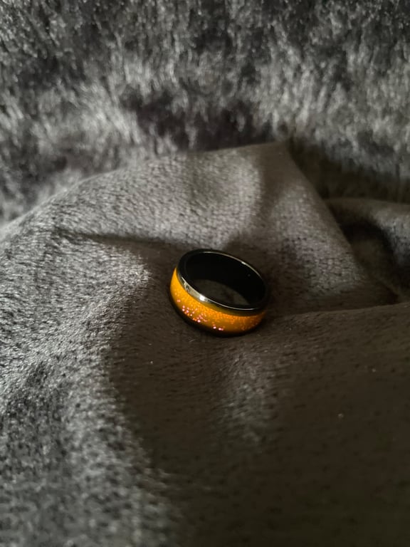 Resin ring with pink glitter and light orange base 