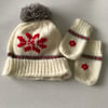 Hand knitted baby pompom hat and mittens with snowflake design