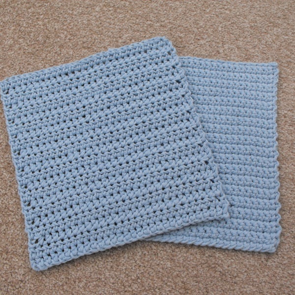 Set of two crocheted dishcloths made from a light blue recycled denim yarn
