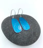 Turquoise anodised aluminium ammonite drop earrings - Image 1