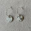 Circular pure silver earrings with leaf detail