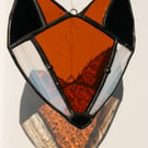 Stained glass fox head suncatcher. Traditional Tiffany style.