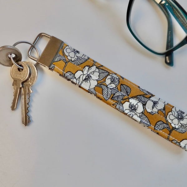 Key ring wrist strap in mustard ochre floral fabric 