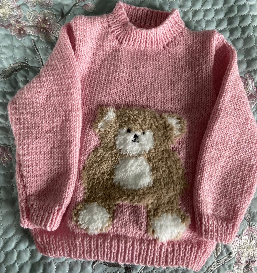 Hand Knitted  sweet teddy bear motif jumper in soft pink Merino yarn 