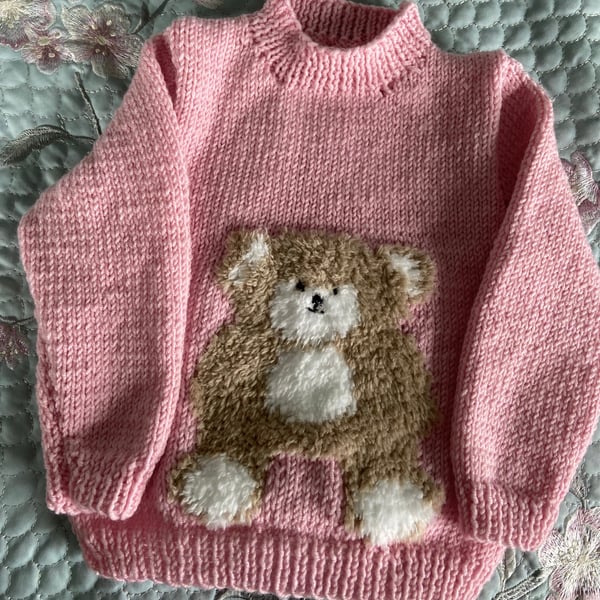 Hand Knitted  sweet teddy bear motif jumper in soft pink Merino yarn 