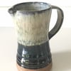 Stoneware pottery jug,  blue, white and black combination glaze.