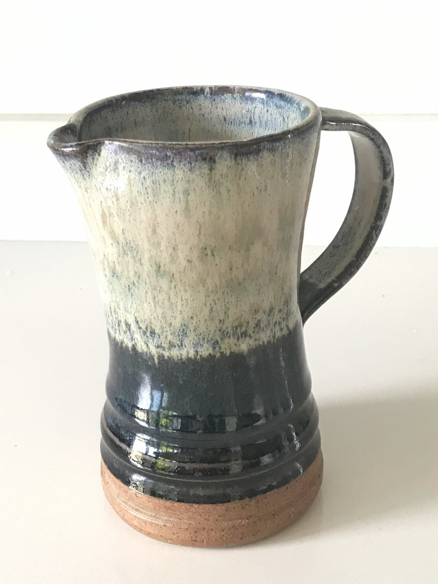 Stoneware pottery jug,  blue, white and black combination glaze.