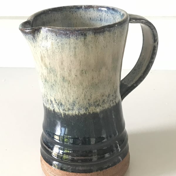 Stoneware pottery jug,  blue, white and black combination glaze.