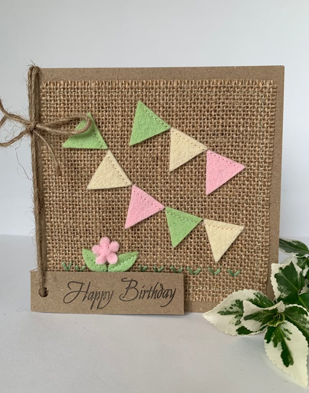 Handmade birthday card. Bunting in pale green, pink and cream from wool felt.