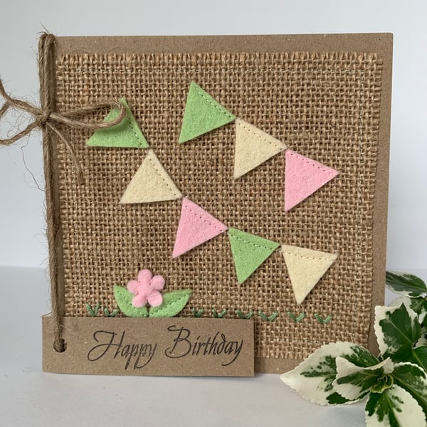 Handmade birthday card. Bunting in pale green, pink and cream from wool felt.