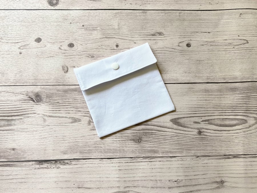 Plain white cotton fabric pad pouch. Discreet colourful sanitary bag.