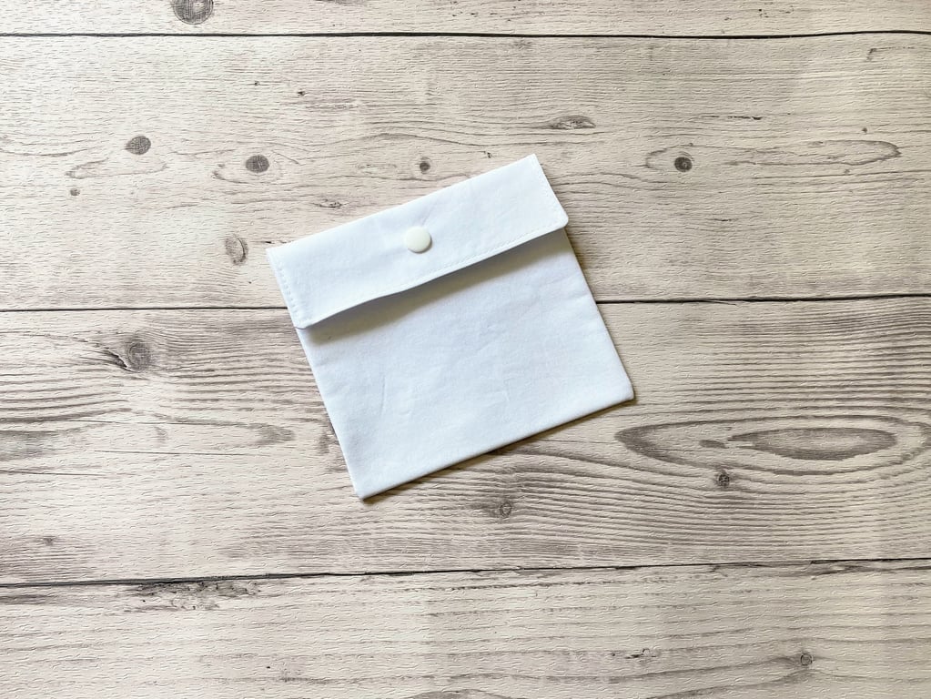 Plain white cotton fabric pad pouch. Discreet colourful sanitary bag.
