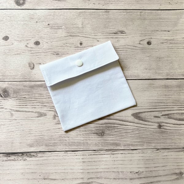 Plain white cotton fabric pad pouch. Discreet colourful sanitary bag.