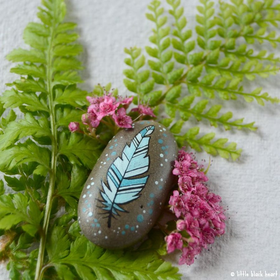 painted pebble - blue feather