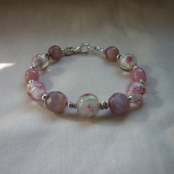 SHADES OF PINK AND SILVER LAMPWORK BEADED BRACELET.  1032