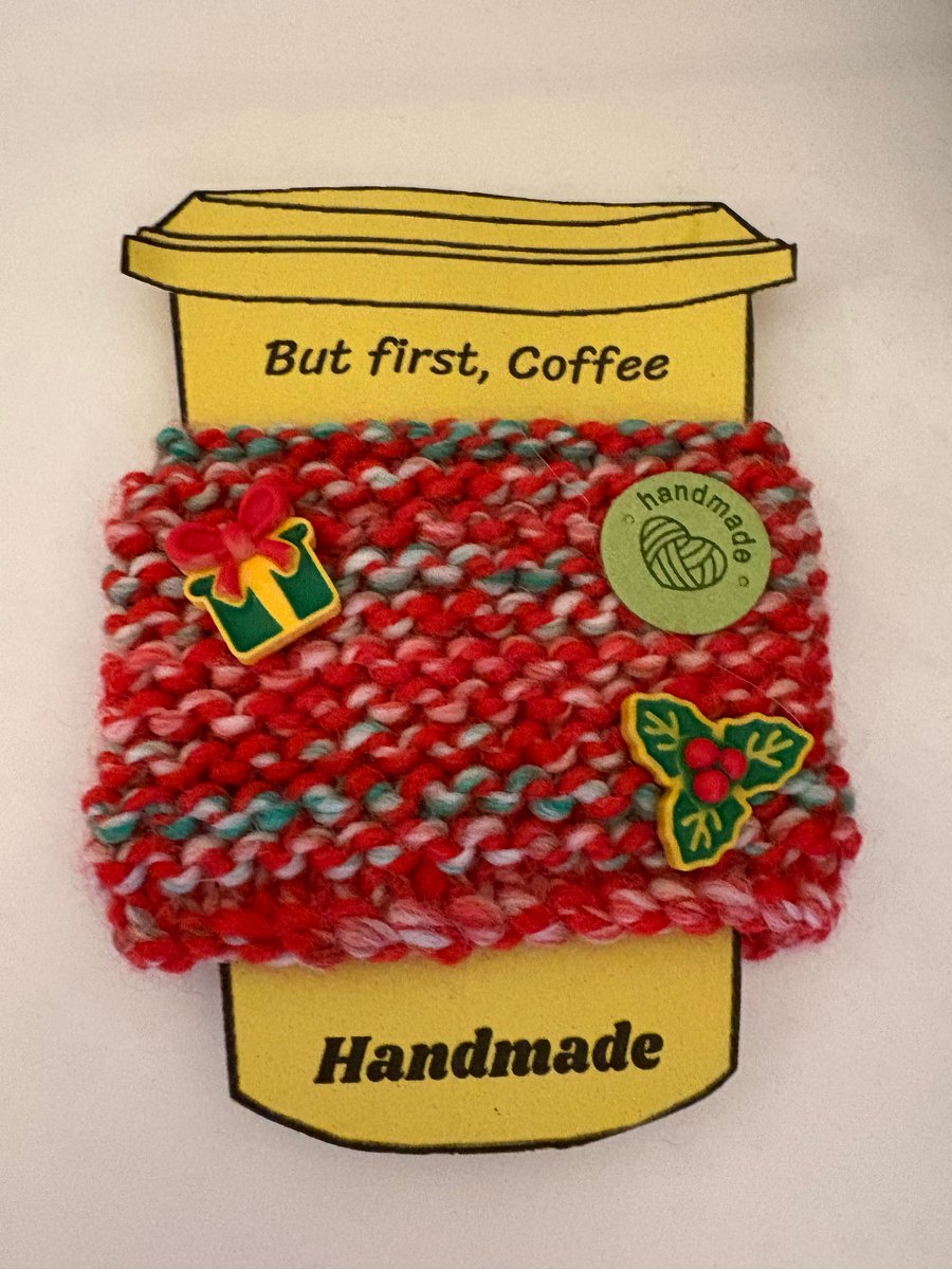 Christmas knitted cup cosy with Christmas parcel and holly embellishments. 