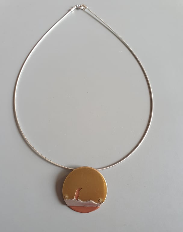 Brass and copper pendant - Penguin on ice 