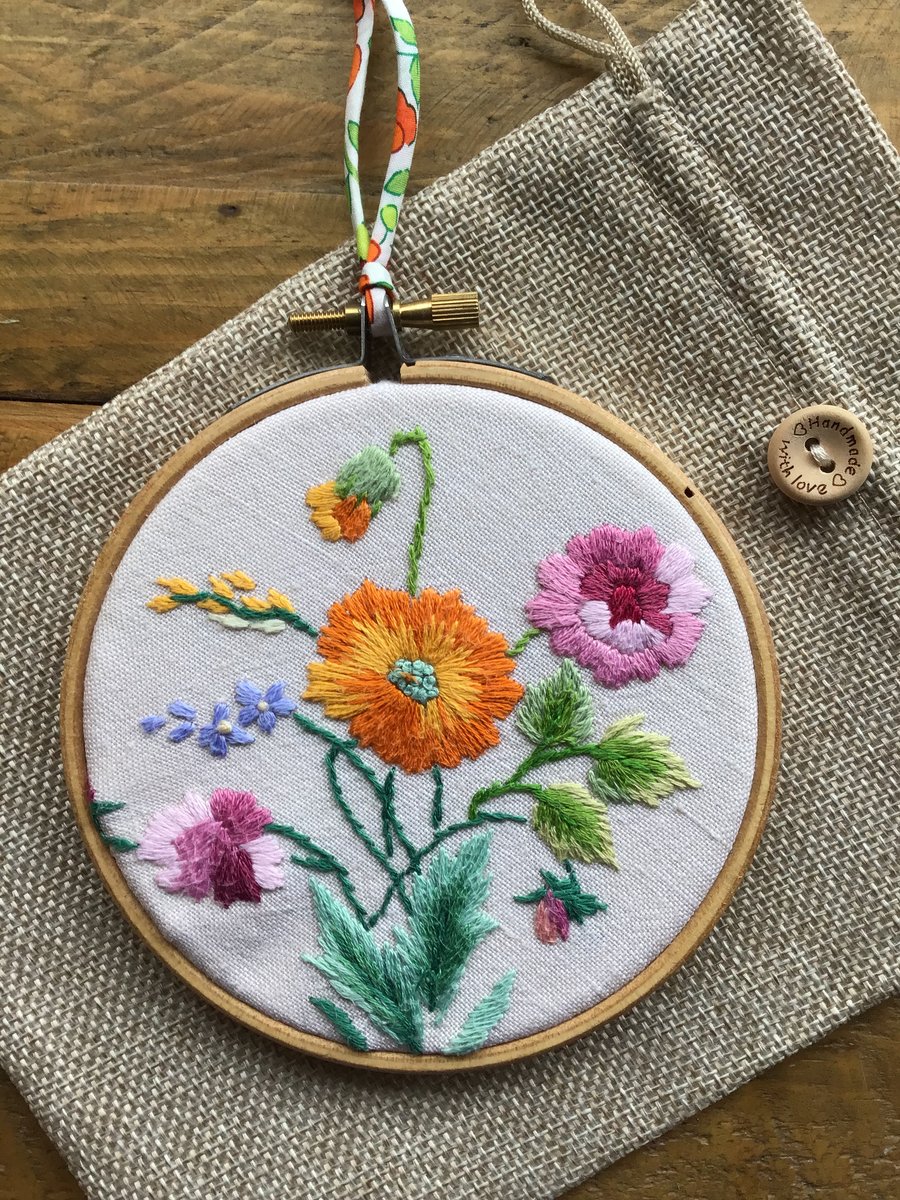 Repurposed embroidery hoop art.