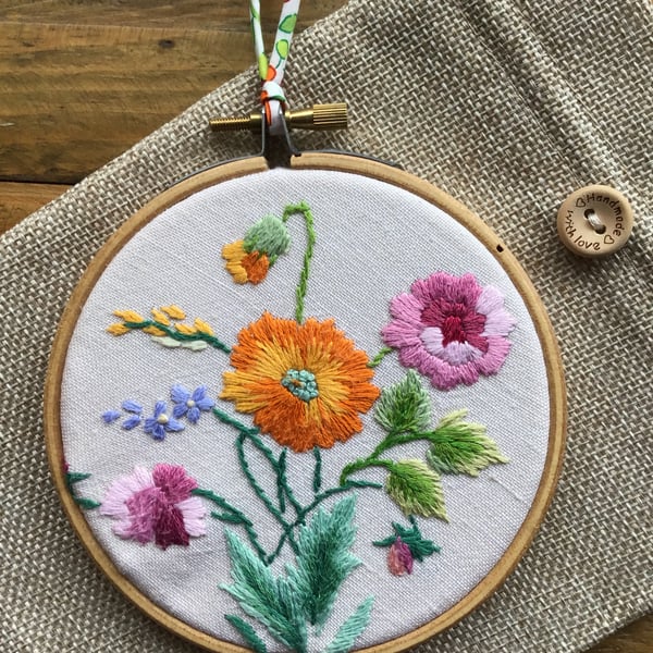 Repurposed embroidery hoop art.