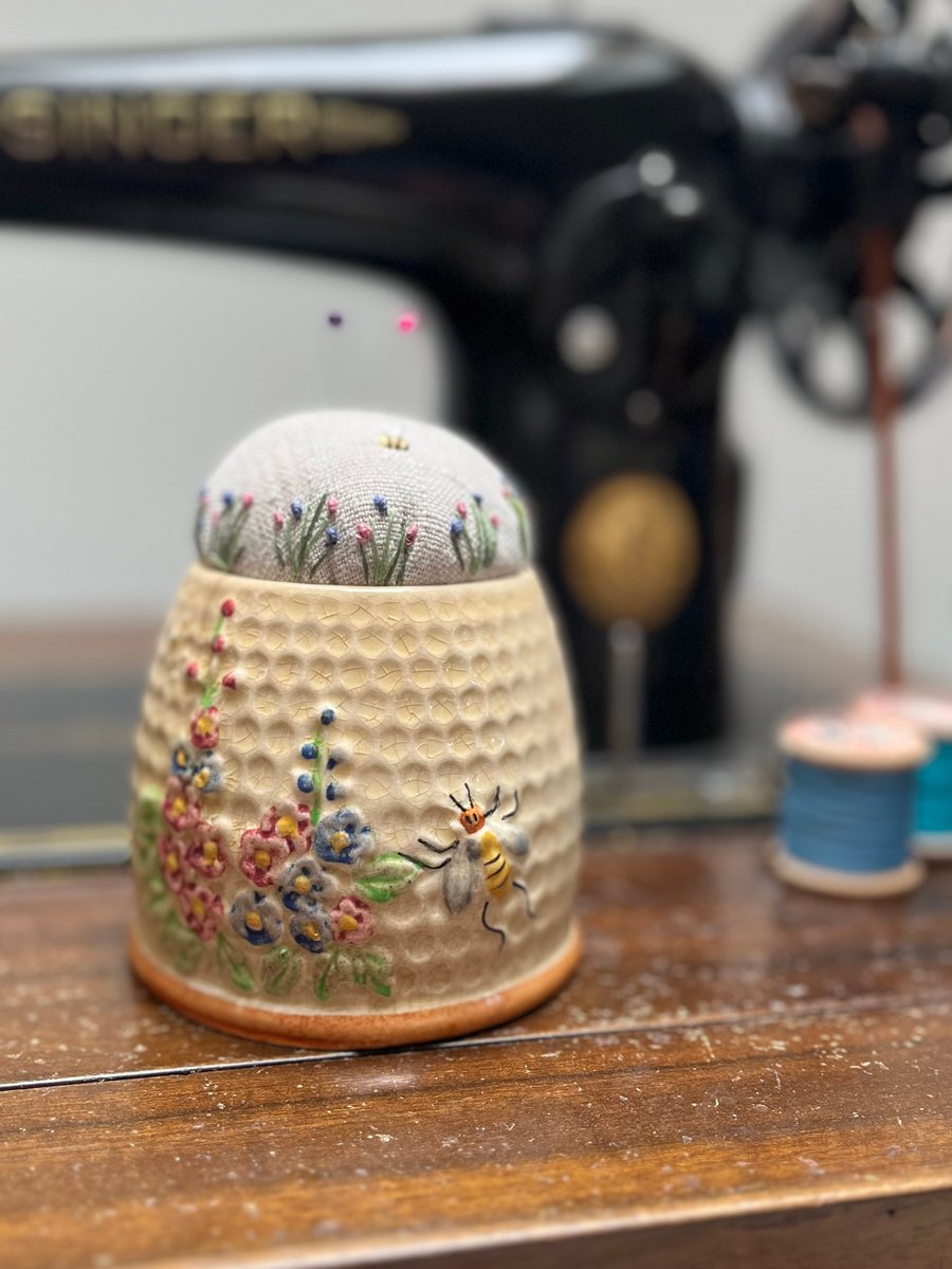 Pin cushion in an old honey pot embroidered flowers and bee