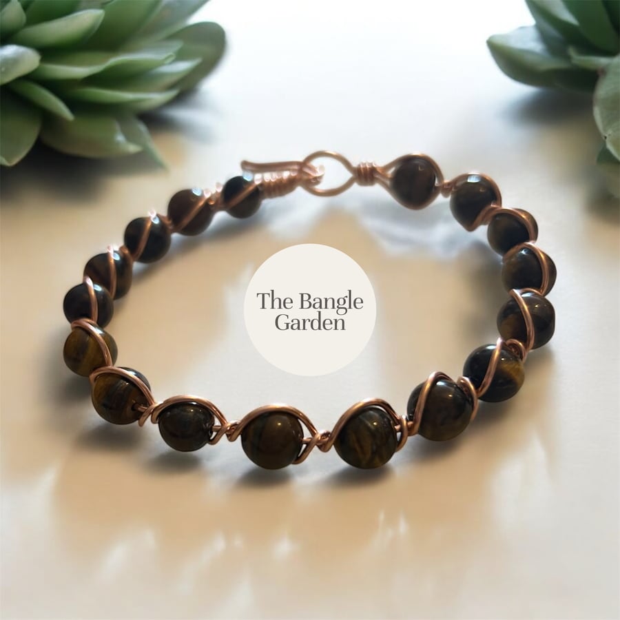 Handmade wire wrapped copper coloured bangle with tigers eye beads 