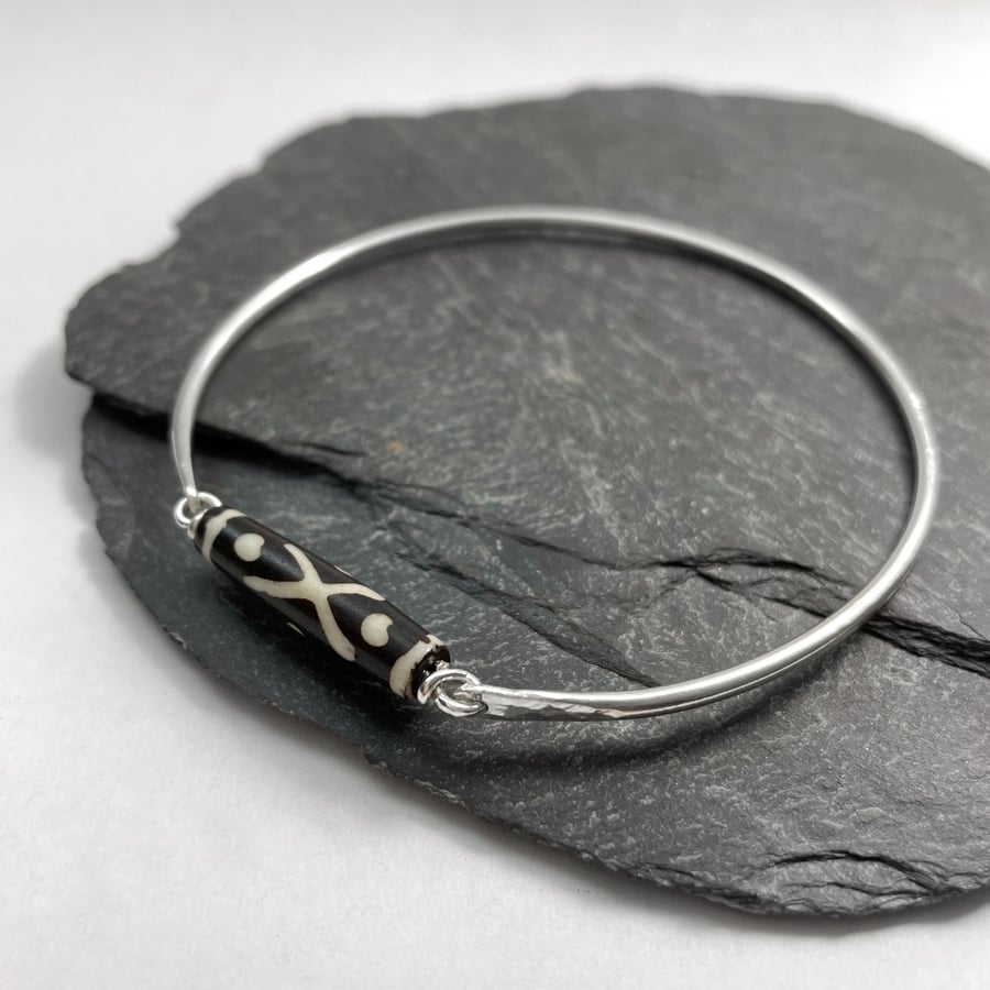Sterling silver bangle with bone Dzi bead