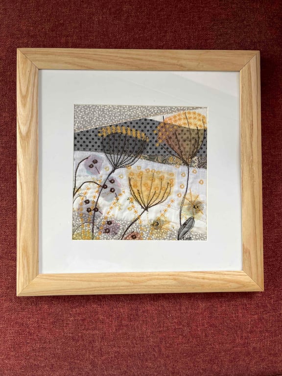 Textile picture with seed heads and honesty.