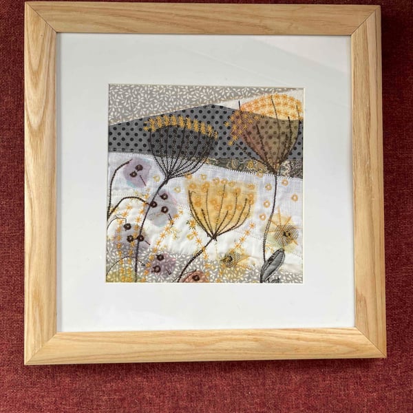 Textile picture with seed heads and honesty.