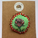 Handmade and hand painted fabric pin brooch with rose design 