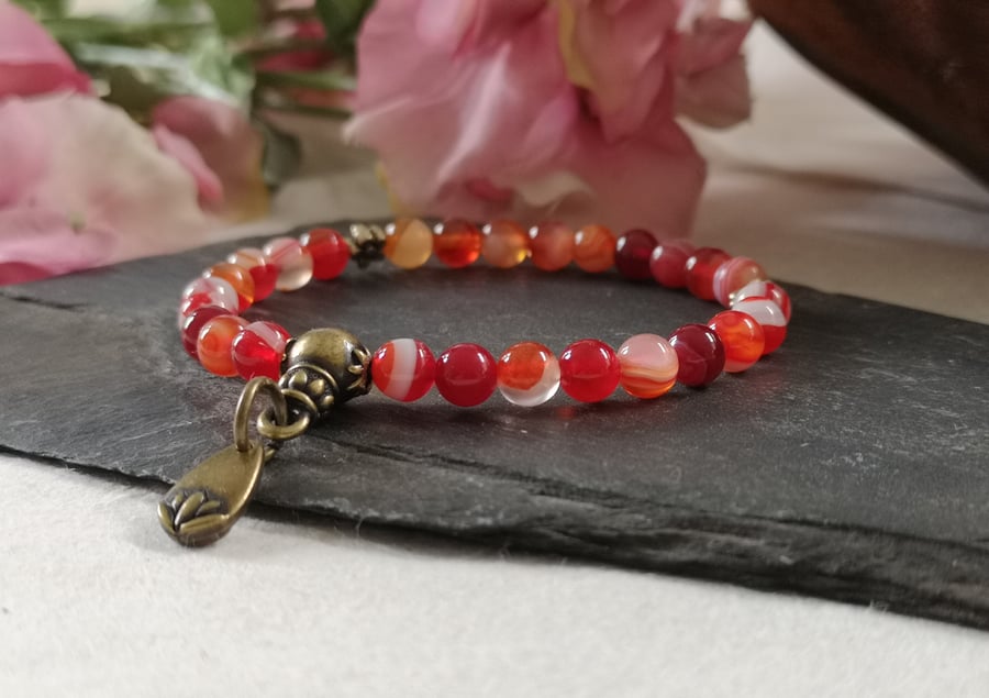 Red agate 27 bead mala stretch bracelet with lotus charm