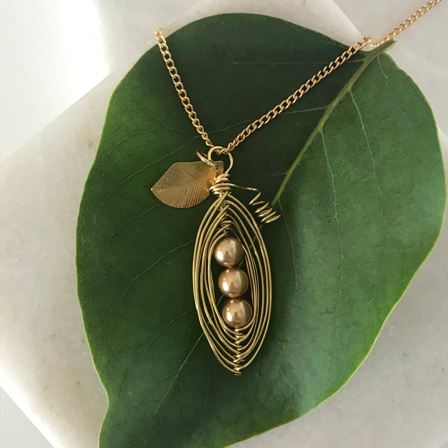 Handmade gold tone pea pod necklace with leaf charm