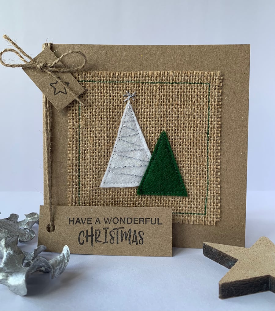 Handmade Christmas Card. Festive trees with silver sparkle. Christmas greetings.