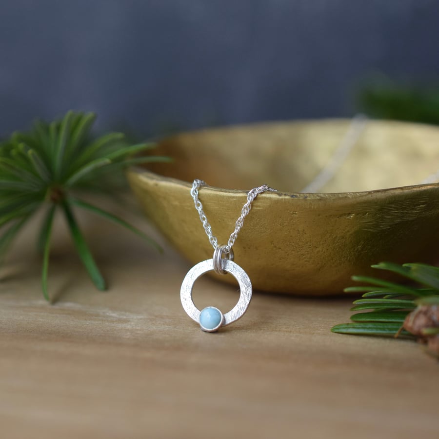 Sterling silver circle pendant with larimar gemstone