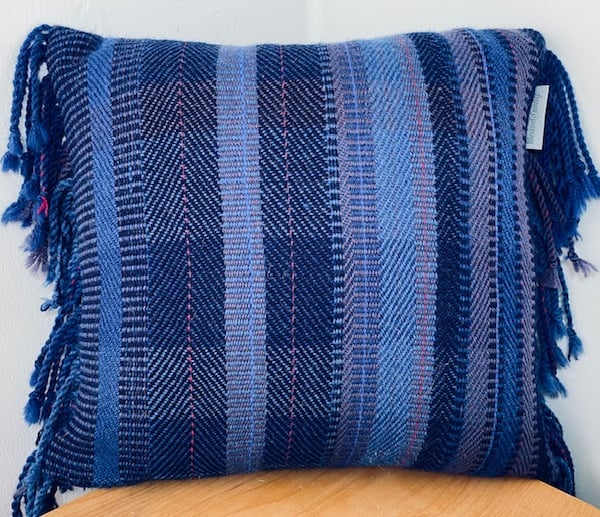 Hand woven 100% wool cushion in a range of brilliant blues