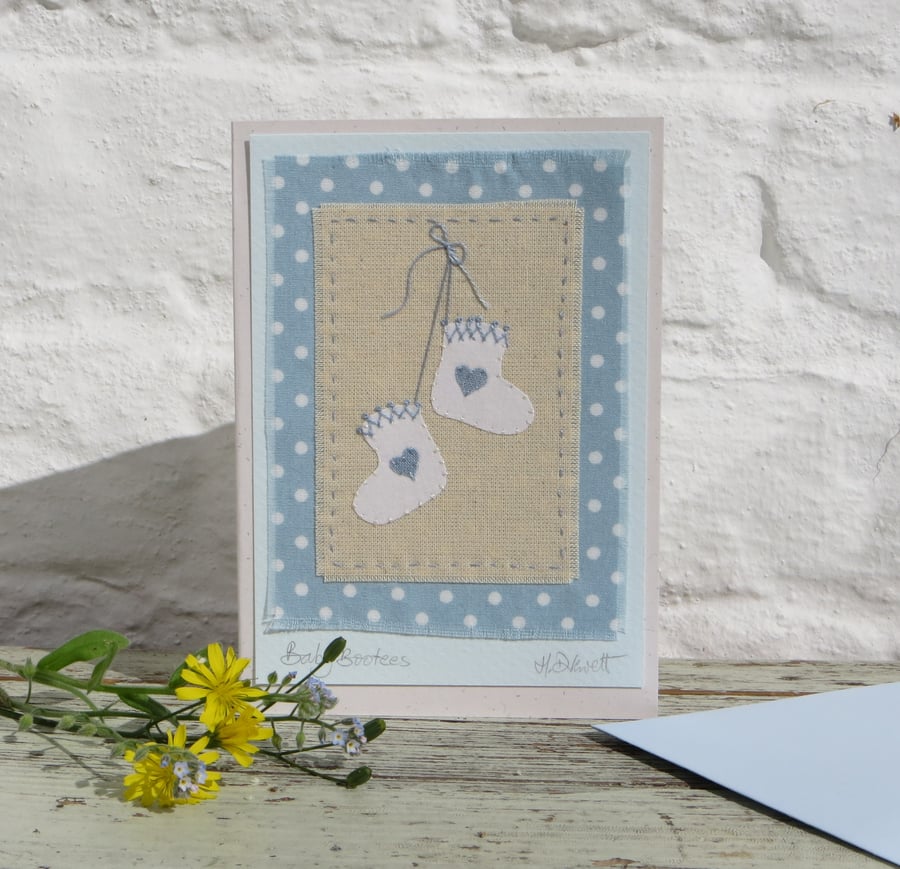 Pretty hand-stitched baby bootees with hearts and bow - very sweet!