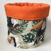 Large fabric basket: plant pot, cosmetics etc Tropical print with orange.
